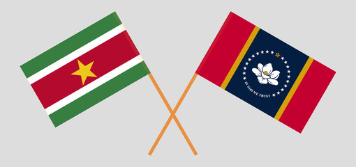 Crossed flags of Suriname and the State of Mississippi. Official colors. Correct proportion