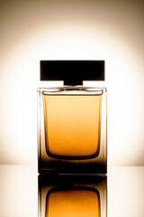 luxury perfume bottle over gradient background. fragrance silhouette