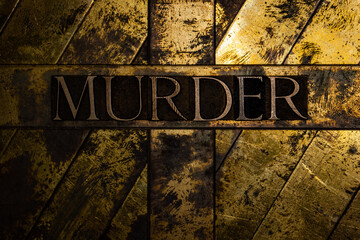 Murder text on vintage textured silver grunge copper and gold background