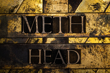 Meth Head text message on textured grunge copper and vintage gold background
