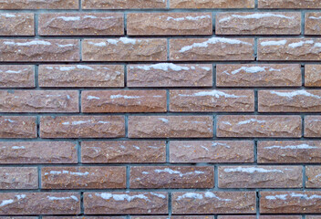 Obraz premium background brick fence in the snow
