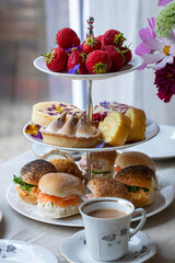 Afternoon tea with cakes and sandwiches