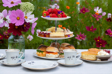 Afternoon tea with cakes and sandwiches
