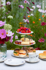 Afternoon tea with cakes and sandwiches