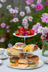 Afternoon tea with cakes and sandwiches