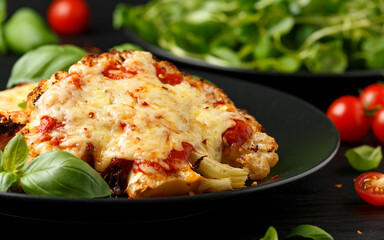 Baked Cauliflower steak with marinara sauce and cheese on plate. Healthy vegetarian food