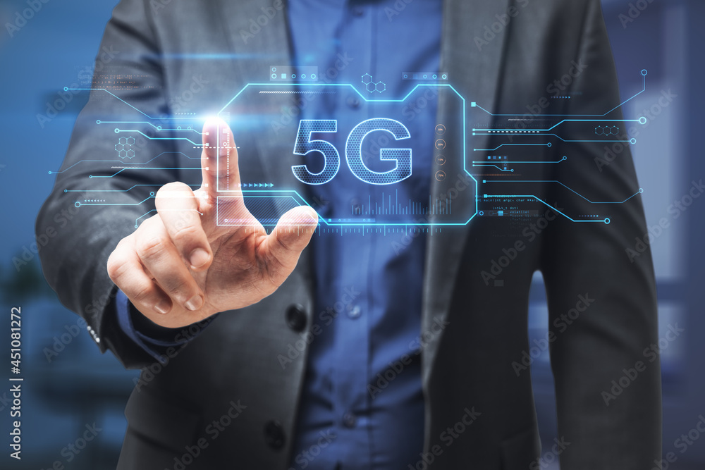 Poster hand in blurry office pointing at abstract 5g hologram. communication and speed concept. double expo