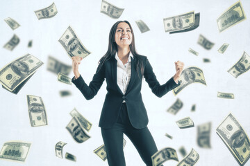 Attractive young european businesswoman celebrating success on white background with dollar...