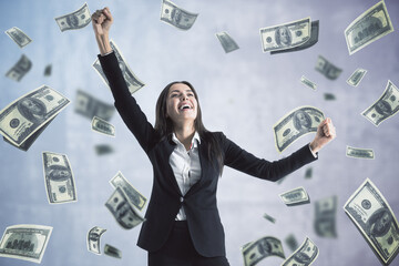 Attractive young european woman celebrating success on white background with dollar banknote rain....