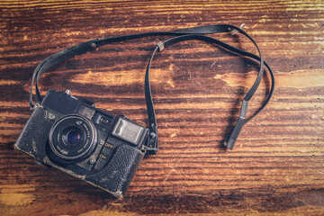 vintage camera on wooden background
