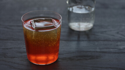 Making non alcohol spritz drink in a tumbler glass