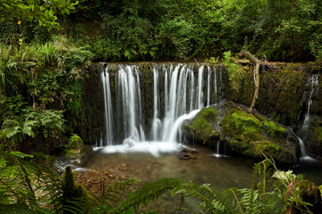 Fototapeta na wymiar Beautiful waterfall in a forest in Galicia, Spain, known by the name of San Pedro de Incio.