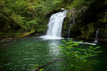 Fototapeta na wymiar Beautiful waterfall hidden in a remote part of Galicia, Spain.