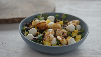 seasoning salad with shrimps, mango, mozzarella and micro greens
