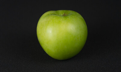  green apple with black background
