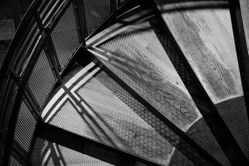 Shadows on the stairs of handrail - black and white