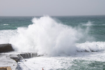waves crashing on rocks