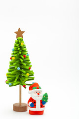 Little Santa Claus toy with decorative green beautiful handmade New year tree isolated on white background. christmas and new year concept
