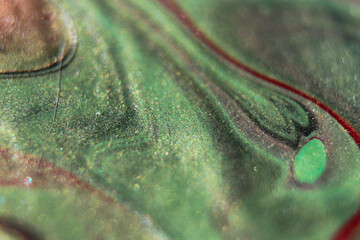 Red stripe of paint across green background