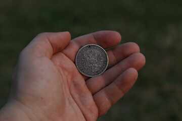Fototapeta na wymiar Old Russian silver coin one ruble in hand