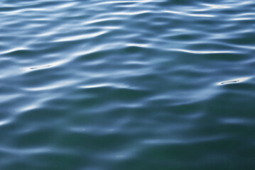 Blue smooth surface of the sea, blue water, nature.