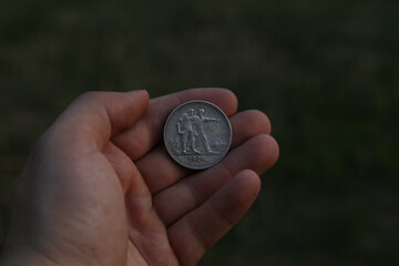 Old silver soviet coin half ruble in hand