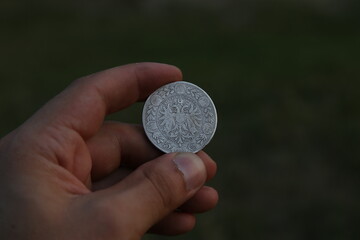 Old silver Polish coin in hand