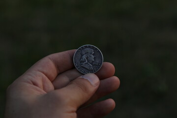 Vintage American coin half dollar in hand