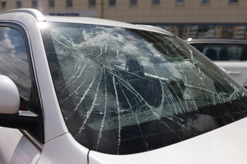 Closeup of cracks on broken car windshield