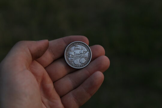 Vintage American coin half dollar in hand