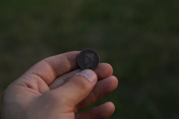 Vintage Italian coin in hand