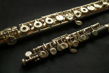 Musical wind instrument piccolo flute and brass flute. High quality photo