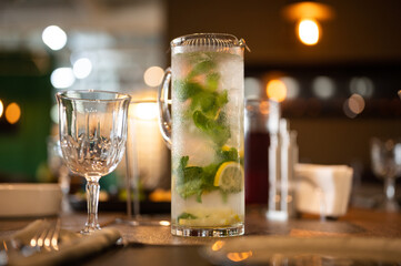 Ice cold lemonade in cafe. Mint and lemon cold drink