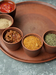 Pepper,paprika, basilik.Georgian food. Georgian spices on a plate.	