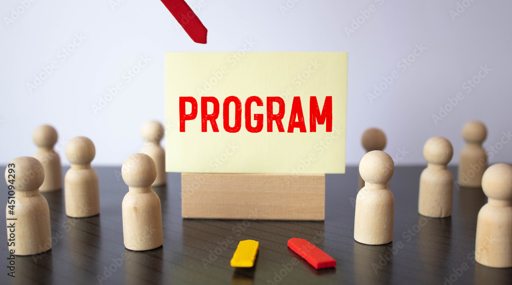 Poster concept of the word program on paper on a gray background. business concept.