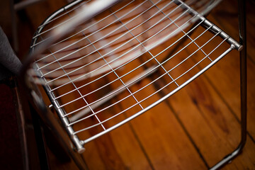 Obraz premium metal stylish chair made of metal bars