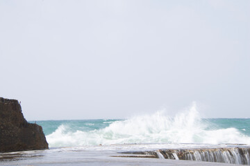 waves crashing on rocks