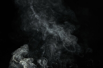A cloud of a burning smoke isolated  with black background. Good graphical resource for overlay effects to other photos. 
