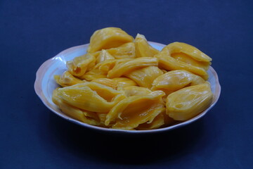Jackfruit on a plate with a dark background