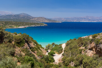 Fototapeta na wymiar Beautiful clear, warm ocean and dry, summer coastline at Voulisma, Crete, Greece
