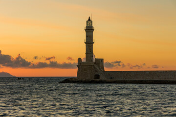 Ancient venetian lighthouse in the Cretan city of Chania at dusk