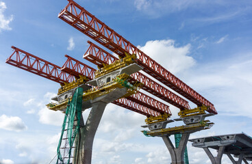 Construction bridge under construction on blue sky background.