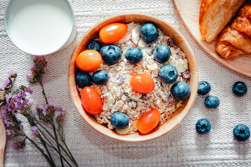 Homemade Granola Muesli Oatmeal for Breakfast Food, Granola With Fresh Fruit and Milk for Breakfast. Natural Baked Muesli and Mixing Fruits for Morning Meals. Diet Granola Homemade Meal for Healthy