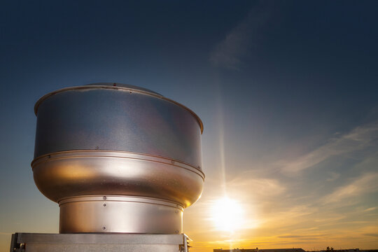AC unit stack on a rooftop on a sunrise sunset