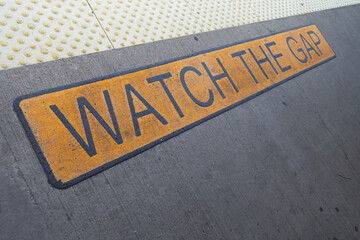NEW York CITY subway platform floor sign watch the gap