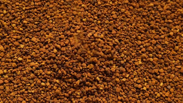 Propolis granules close-up.Honey and pollen. Honey products. Beekeeping product. honey propolis granules close-up. rotation. High quality 4k footage