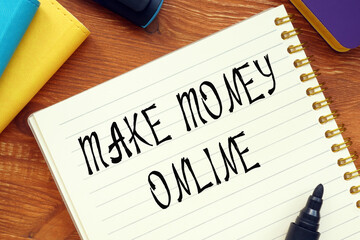 Business concept about MAKE MONEY ONLINE question marks with sign on the sheet.