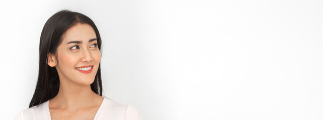 Portrait of smiling cheerful beautiful pretty asian woman clean fresh healthy white skin posing in pajamas white clothes.Girl felling relaxing and enjoy time on white background.asia beauty