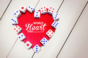Dices shape heart symbol with world heart day text