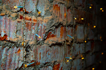 Eelectric garland on brick wall background